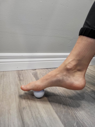 A team member at Oakville clinic showing best home treatment for Mortons Neuroma