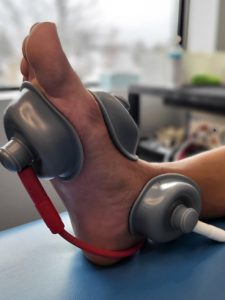IFC treatment being performed on foot to release foot pain