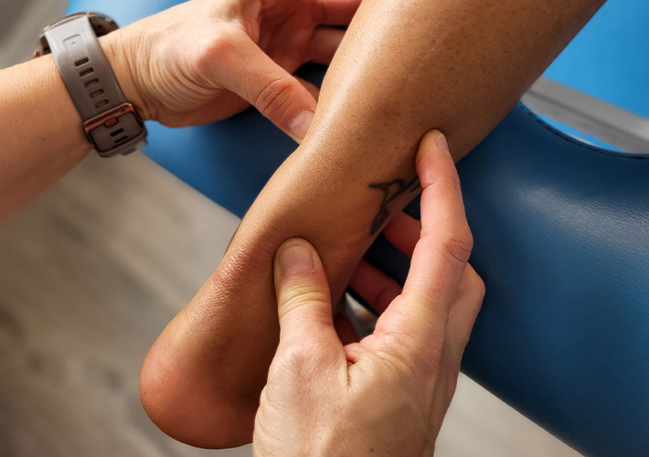 Physiotherapy being performed for foot pain on patient