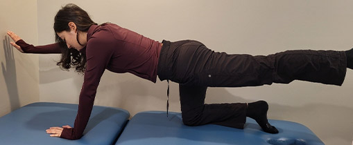 A team member from Oakville clinic showing correct way of exercise 