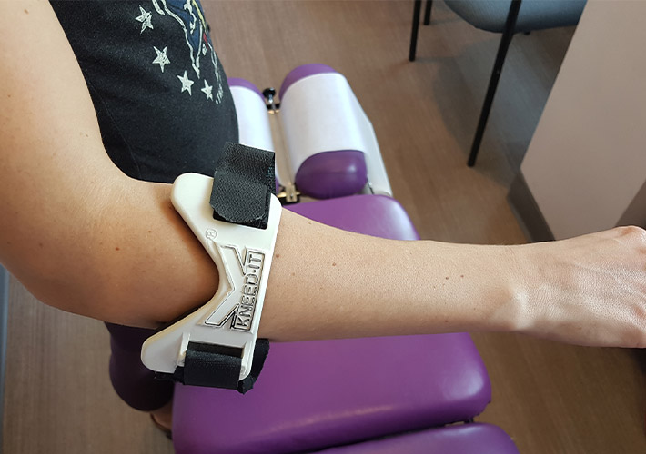 A patient using elbow brace for pain